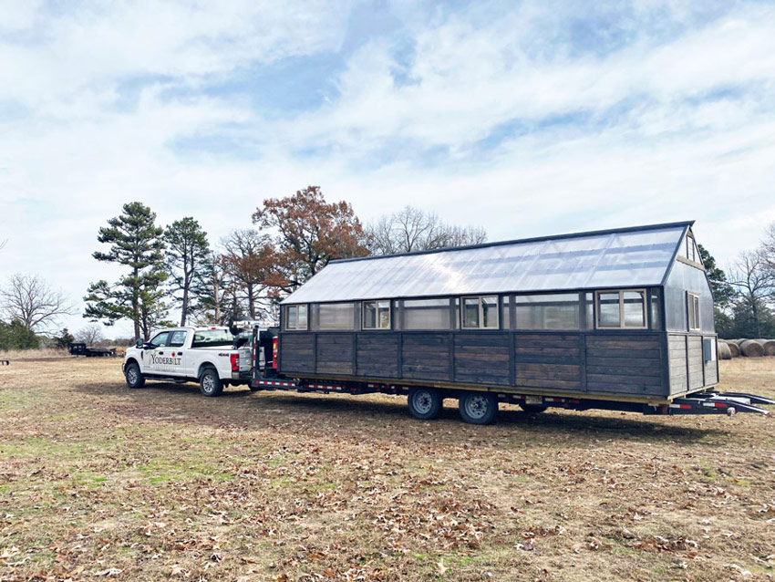 Yoderbilt Greenhouse delivery truck with a greenhouse loaded on the trailer