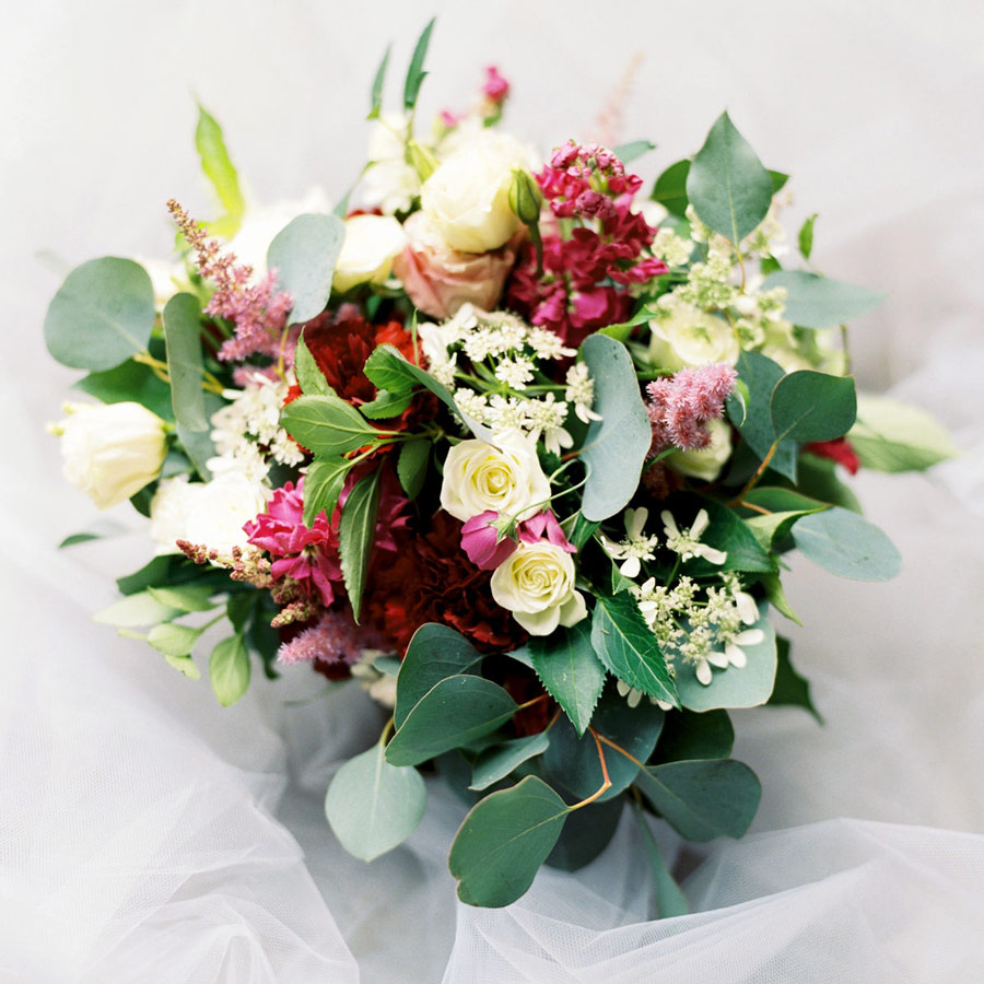 Bouquet of flowers on a touel sheet.