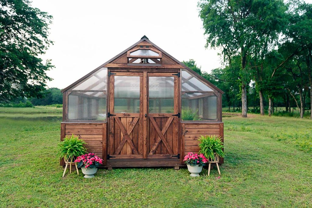 12x12 legacy greenhouse with brown stain and brown metal trim - this greenhouse features a double door