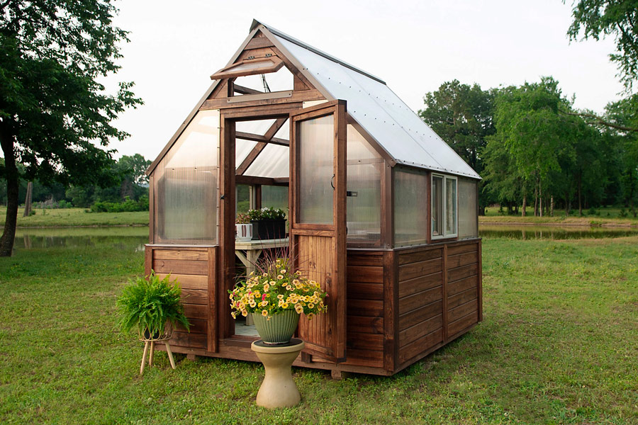 Exterior of an 8x8 Yoderbilt Greenhouse with brown stain.