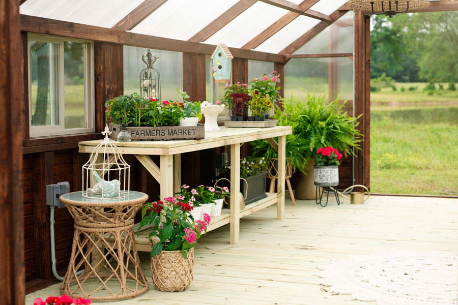 Interior of a yoderbilt greenhouse. Showing a table with decor.