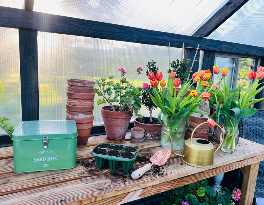 Gardening tools inside of a Yoderbilt Greenhouse