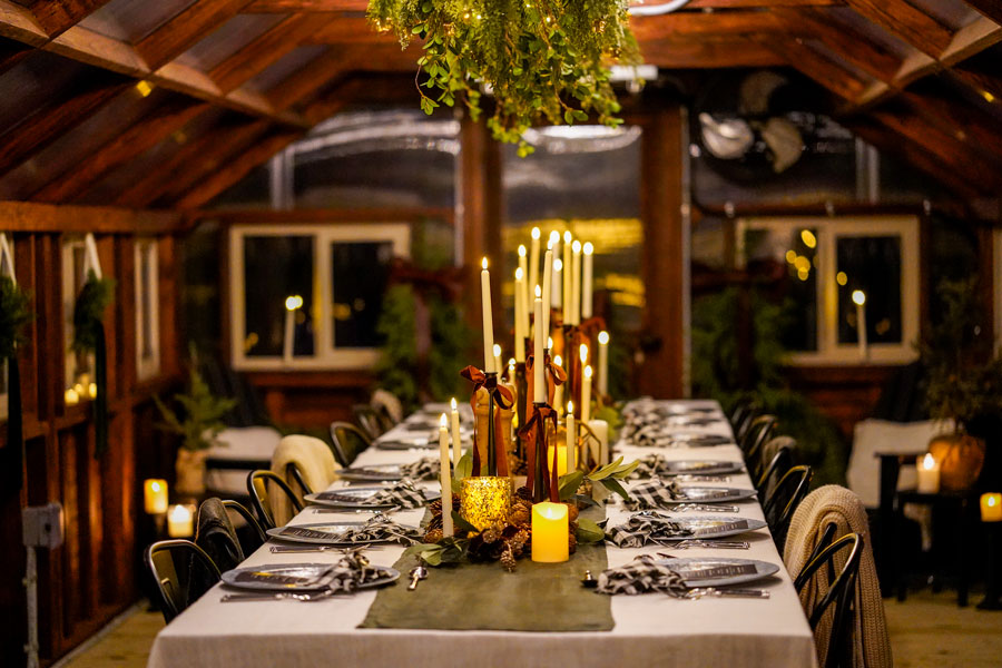 Decorative candles inside of a Yoderbilt Greenhouse in winter